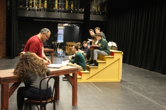 Director Sandy Nagar, left, works with the cast of Chicago at a recent rehearsal.