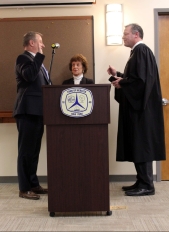 Tom Flaherty's mother Diane held the Bible during his swearing-in.